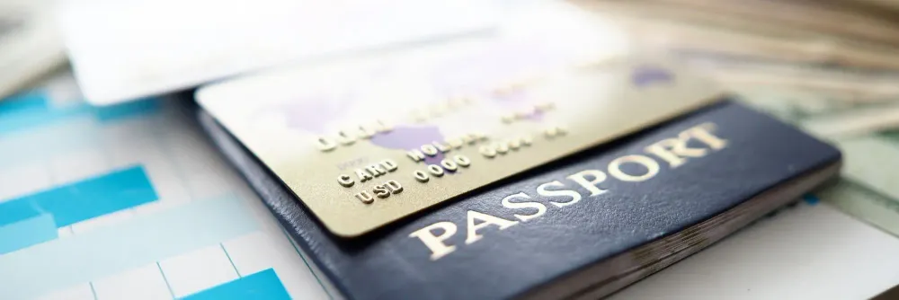Close up of credit card on top of a passport